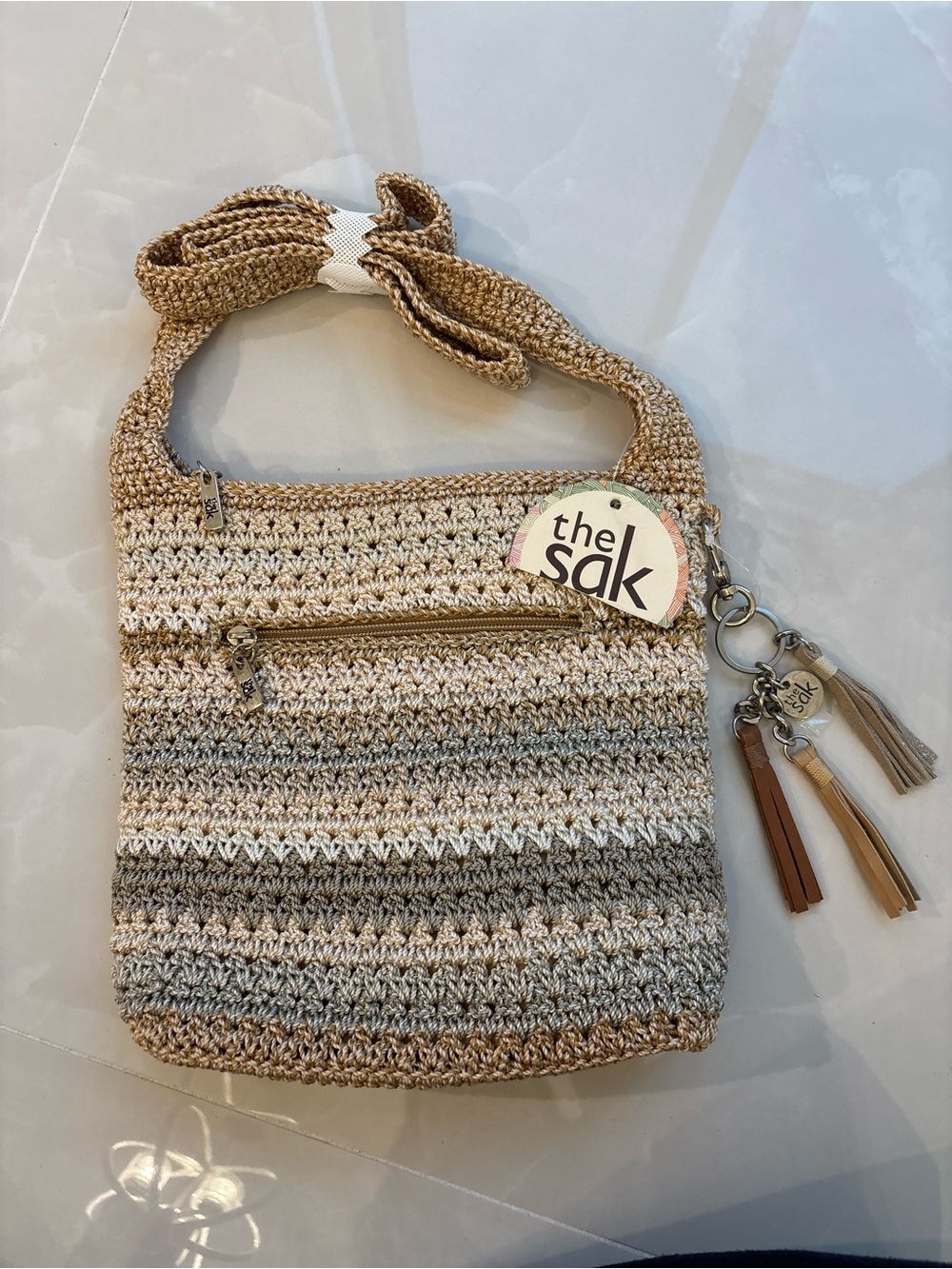 NWT The Sak Hand-Crocheted Beige Bag W Tassel Charm